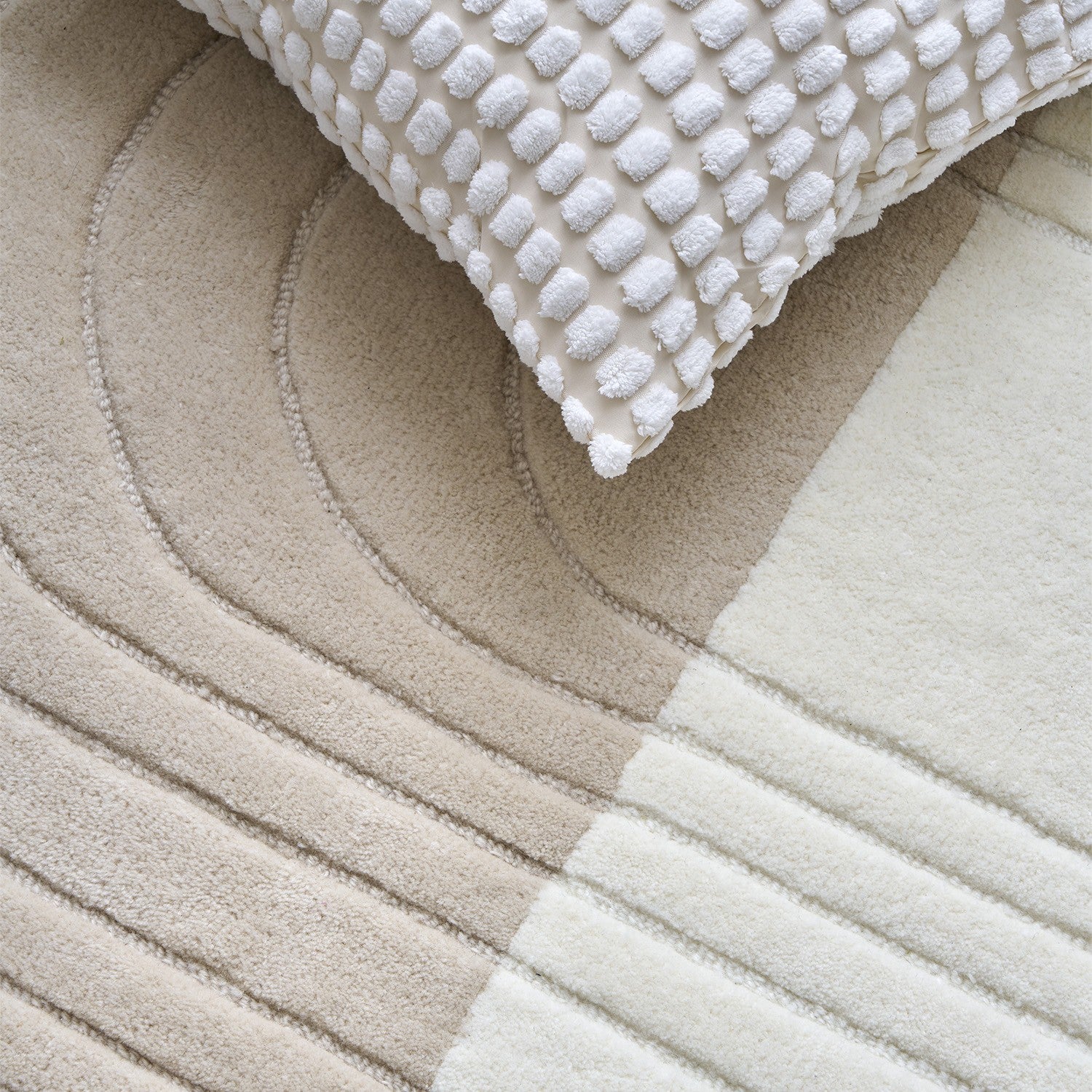 Zoom texture tapis laine Edito