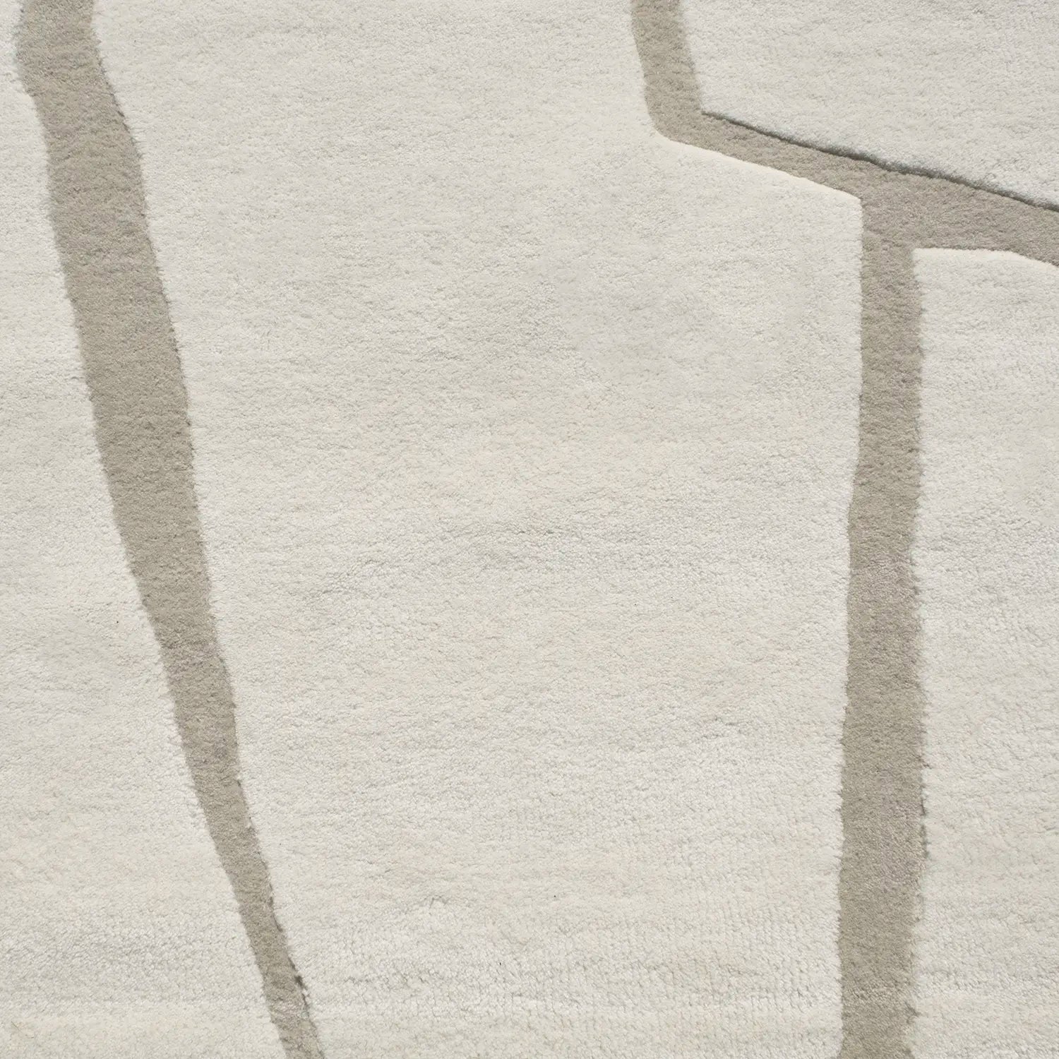 Zoom texture tapis en laine beige et blanc