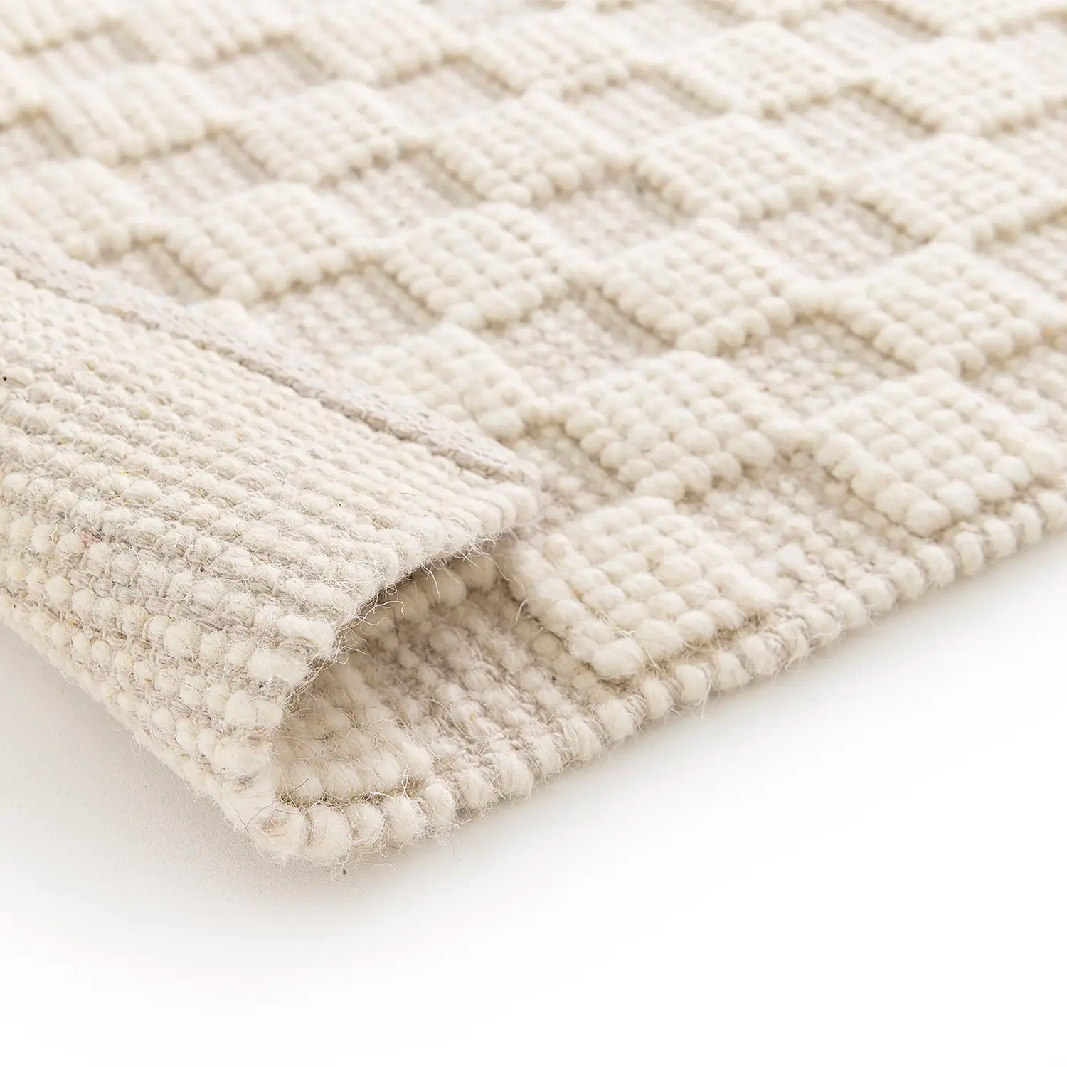 Zoom tapis laine blanc damier