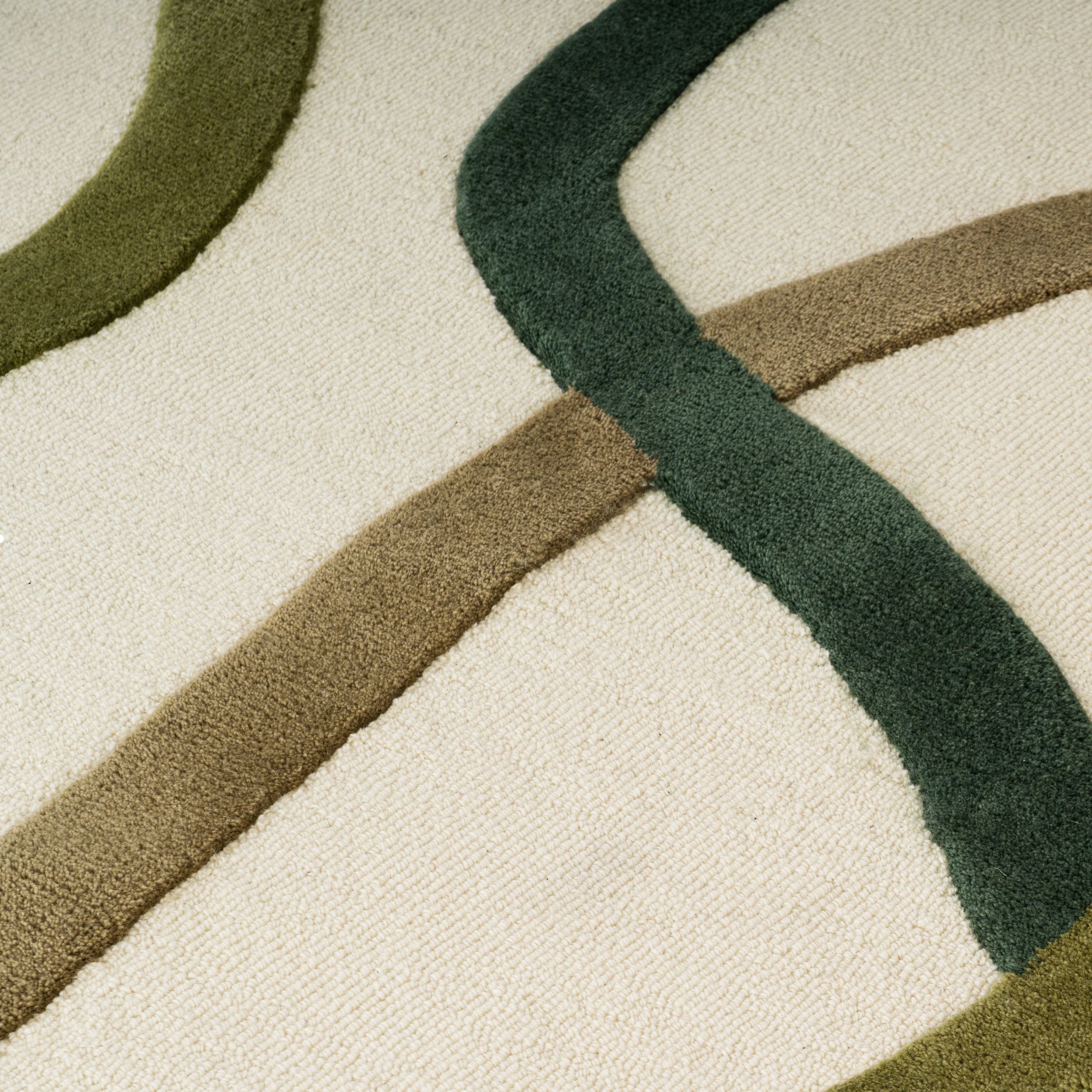 Zoom texture tapis en laine crème et vert