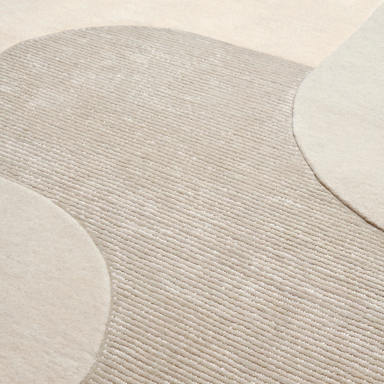 Zoom matière tapis beige en laine