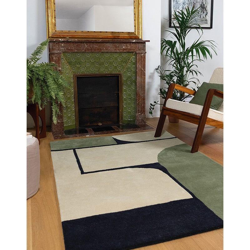 Tapis noir et vert devant cheminé